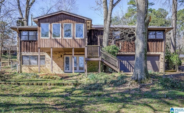 222 Patricia Rd, Madison, AL 35758 - rear view of property with an attached garage, stairs, brick siding, board and batten siding, and french doors