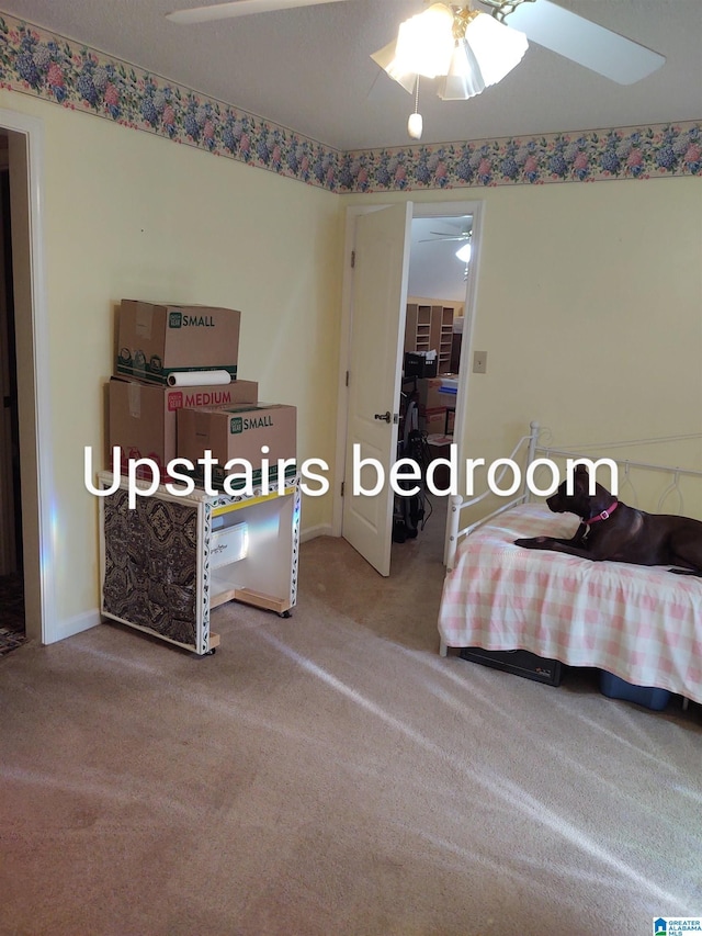 3409 Red Valley Rd, Remlap, AL 35133 - carpeted bedroom with baseboards and a ceiling fan