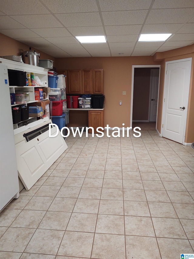3409 Red Valley Rd, Remlap, AL 35133 - kitchen with a drop ceiling, brown cabinets, and light tile patterned flooring