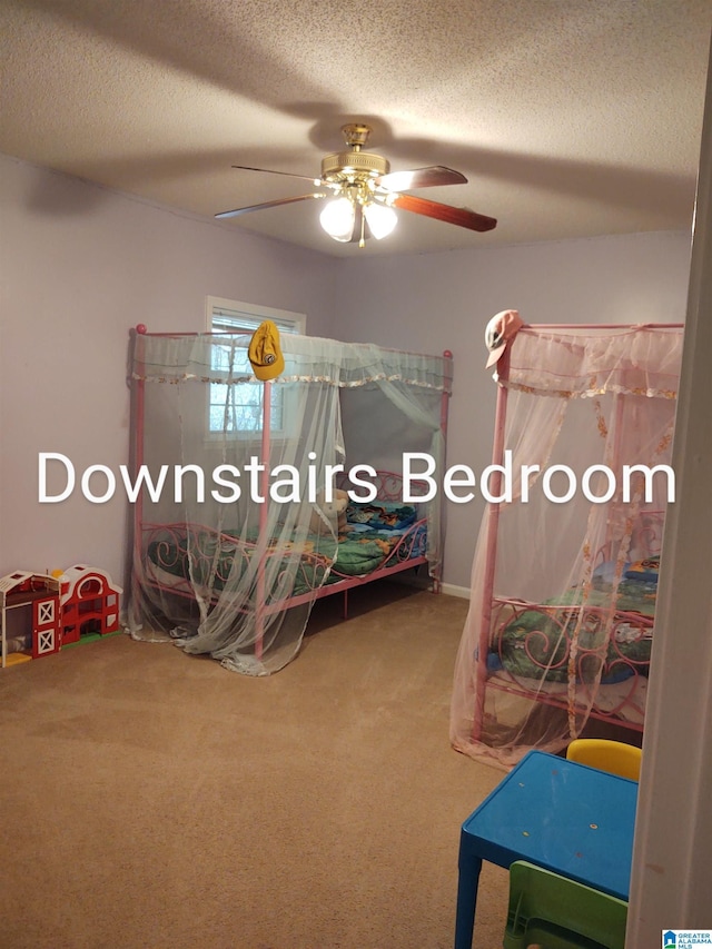3409 Red Valley Rd, Remlap, AL 35133 - bedroom with carpet floors, a textured ceiling, and a ceiling fan