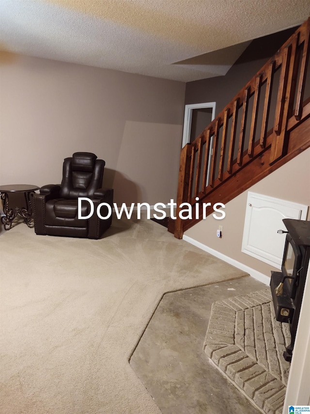 3409 Red Valley Rd, Remlap, AL 35133 - living room with carpet, a textured ceiling, and stairs