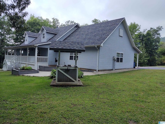 3409 Red Valley Rd, Remlap, AL 35133 - rear view of property with a shingled roof, a yard, and a hot tub