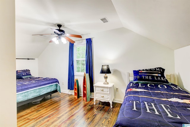 86 Waters Dr, Wedowee, AL 36278 - bedroom with vaulted ceiling, wood finished floors, a ceiling fan, and baseboards