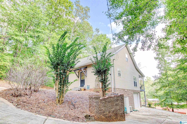 86 Waters Dr, Wedowee, AL 36278 - view of home's exterior featuring an attached garage and driveway