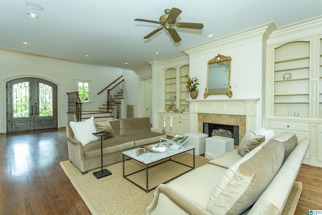 4338 Kings Mountain Rdg, Vestavia Hills, AL 35242 - living room featuring stairway, french doors, built in shelves, ceiling fan, and a fireplace