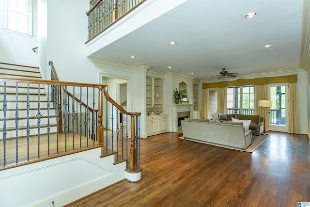 4338 Kings Mountain Rdg, Vestavia Hills, AL 35242 - living area featuring ceiling fan, stairs, crown molding, wood finished floors, and recessed lighting
