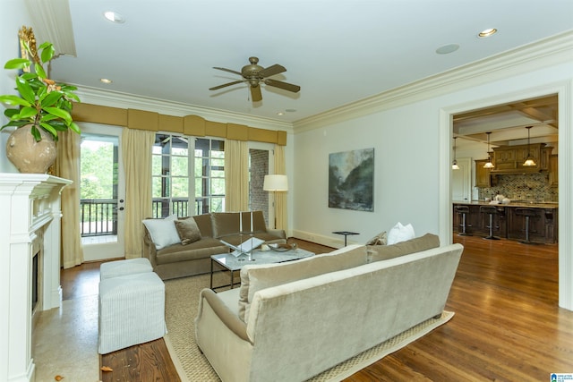 4338 Kings Mountain Rdg, Vestavia Hills, AL 35242 - living room with a ceiling fan, crown molding, dark wood-style floors, a fireplace, and baseboards