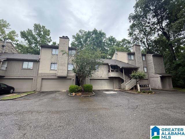 2424 Mallard Dr Unit 2424, Birmingham, AL 35216 - view of front of home featuring a chimney, driveway, and an attached garage