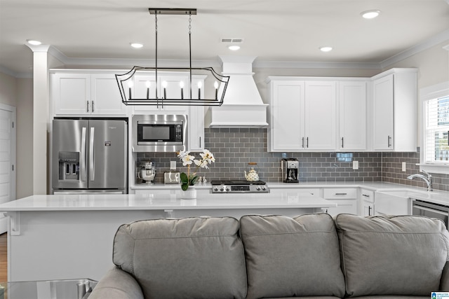 173 Atlantic Ln, Birmingham, AL 35242 - kitchen with appliances with stainless steel finishes, ornamental molding, white cabinetry, light countertops, and open floor plan