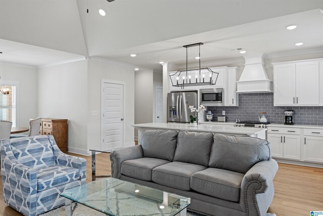 173 Atlantic Ln, Birmingham, AL 35242 - living area with a chandelier, crown molding, light wood-type flooring, recessed lighting, and baseboards