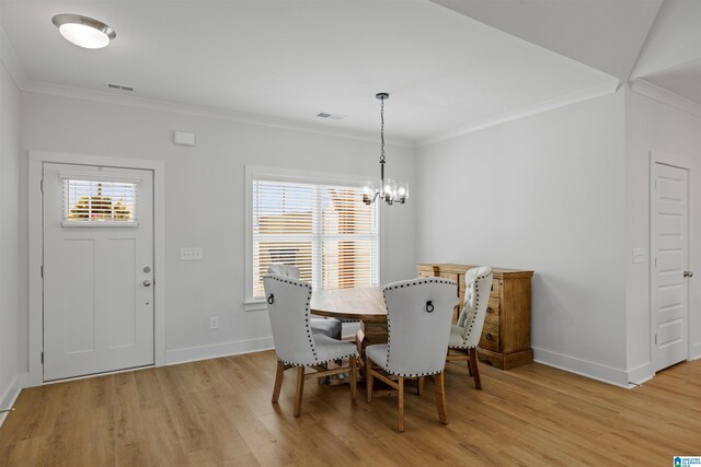 173 Atlantic Ln, Birmingham, AL 35242 - dining area featuring crown molding, light wood-style floors, a chandelier, and baseboards