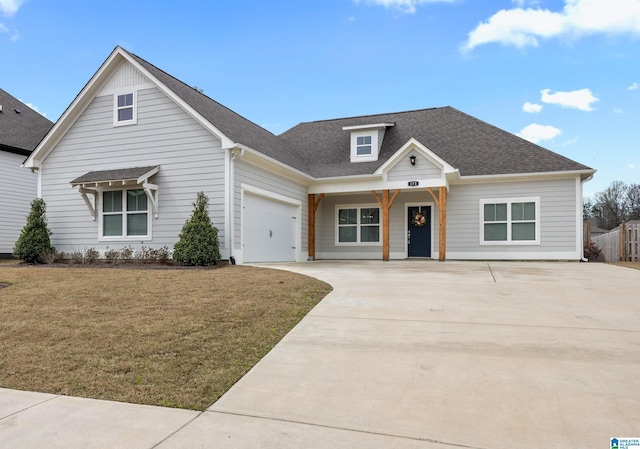 173 Atlantic Ln, Birmingham, AL 35242 - view of front of house featuring concrete driveway, a front lawn, an attached garage, and roof with shingles