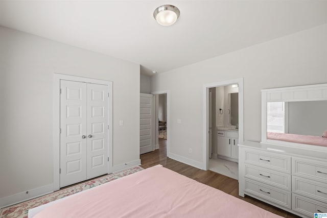 173 Atlantic Ln, Birmingham, AL 35242 - bedroom featuring a closet, wood finished floors, baseboards, and connected bathroom