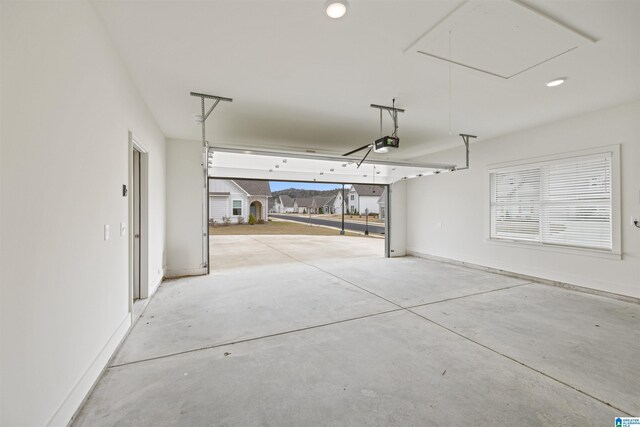 173 Atlantic Ln, Birmingham, AL 35242 - garage with a garage door opener, baseboards, and recessed lighting