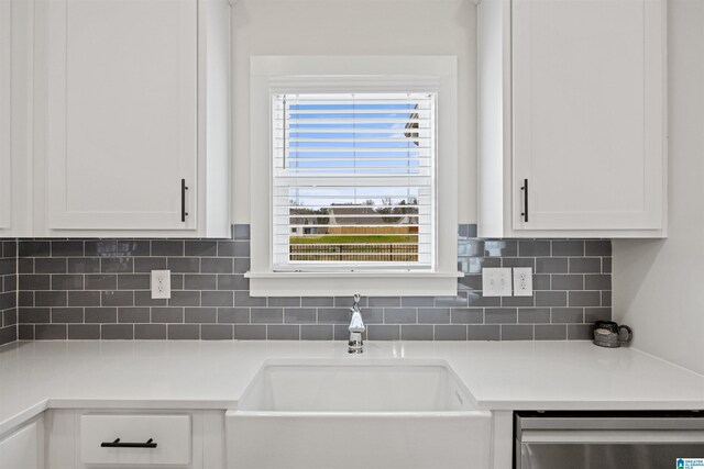 173 Atlantic Ln, Birmingham, AL 35242 - kitchen featuring stainless steel dishwasher, a sink, white cabinetry, and decorative backsplash