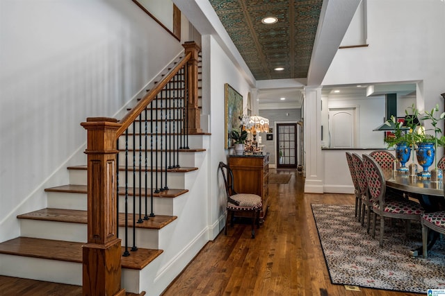 3242 Country Club Rd, Mountain Brook, AL 35213 - stairs with wood finished floors, baseboards, a chandelier, recessed lighting, and ornate columns