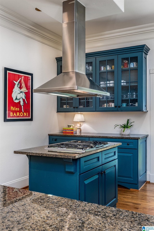 3242 Country Club Rd, Mountain Brook, AL 35213 - kitchen with island range hood, blue cabinetry, dark wood-type flooring, crown molding, and baseboards