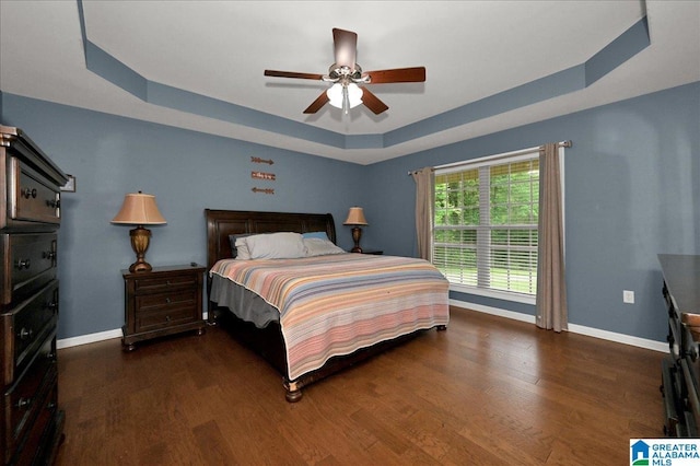 288 Briarfield Rd, Warrior, AL 35180 - bedroom with a raised ceiling, baseboards, wood finished floors, and a ceiling fan