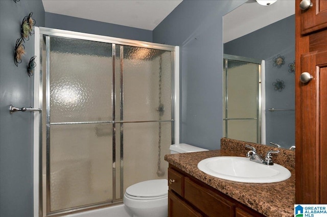 288 Briarfield Rd, Warrior, AL 35180 - bathroom with vanity, a shower stall, and toilet