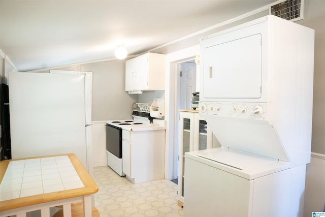231 Smith Camp Loop, Adger, AL 35006 - kitchen with white electric range, estacked washer and dryer, light floors, white cabinetry, and light countertops