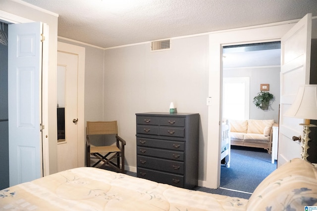 231 Smith Camp Ln, Adger, AL 35006 - carpeted bedroom with a textured ceiling and crown molding