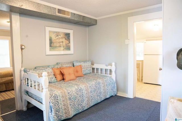 231 Smith Camp Loop, Adger, AL 35006 - bedroom with freestanding refrigerator, crown molding, and tile patterned floors