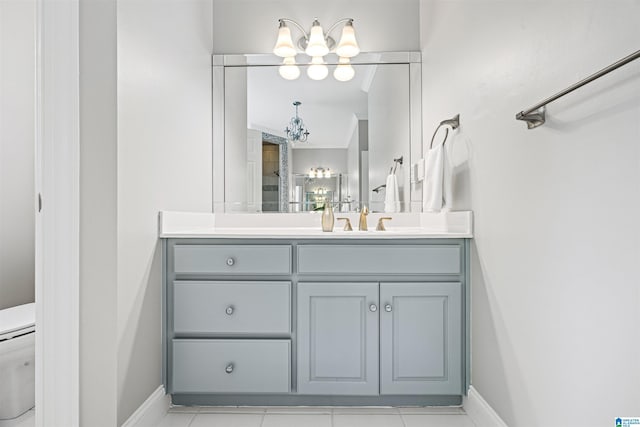 4063 Milners Cres, Hoover, AL 35242 - full bathroom with a chandelier, toilet, vanity, and baseboards