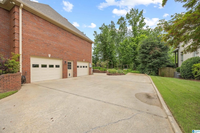 4063 Milners Cres, Hoover, AL 35242 - view of side of property featuring brick siding, driveway, a lawn, and a shingled roof