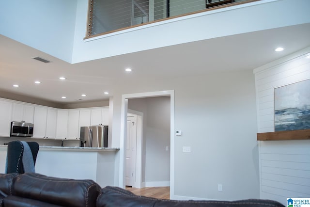 112 Harbor Pointe Dr, Talladega, AL 35160 - living area with recessed lighting, wood finished floors, and baseboards