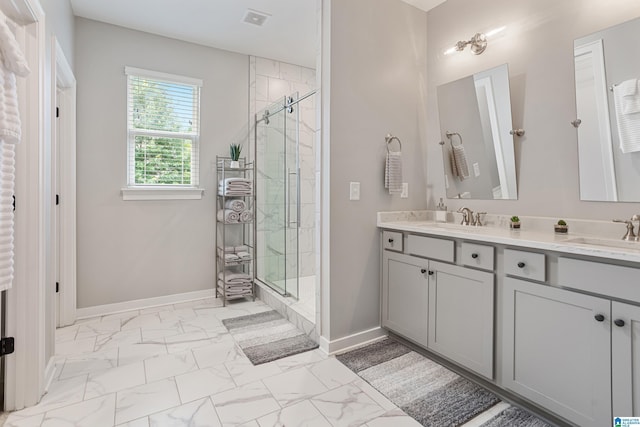 3040 Iris Dr, Hoover, AL 35244 - bathroom with marble look tiles, a shower stall, double vanity, and baseboards