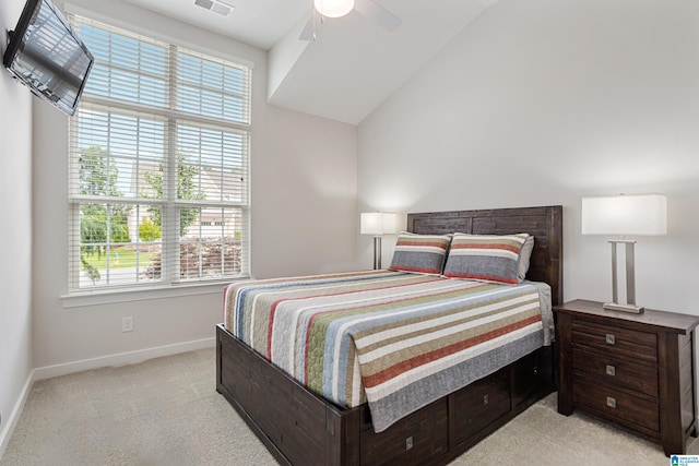 3040 Iris Dr, Hoover, AL 35244 - bedroom featuring light carpet, baseboards, vaulted ceiling, and ceiling fan