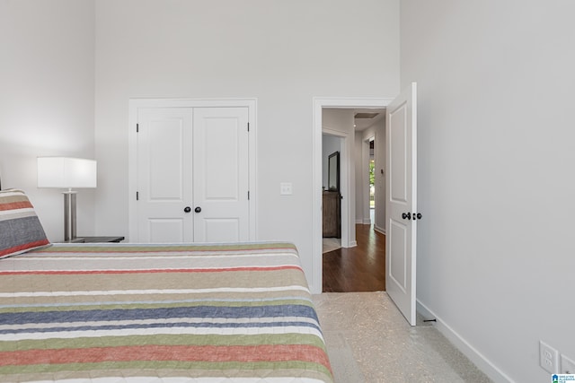 3040 Iris Dr, Hoover, AL 35244 - bedroom with baseboards, a closet, and a high ceiling