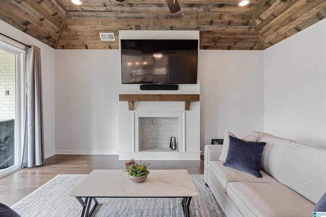 3040 Iris Dr, Hoover, AL 35244 - living room featuring vaulted ceiling, wooden ceiling, a fireplace, ceiling fan, and wood finished floors