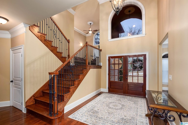 130 Eagle Pointe Way, Pell City, AL 35128 - foyer entrance with ornamental molding, wood finished floors, stairway, a ceiling fan, and baseboards
