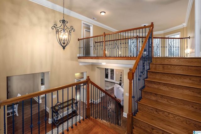 130 Eagle Pointe Way, Pell City, AL 35128 - stairway with wood finished floors, ornamental molding, a chandelier, and baseboards