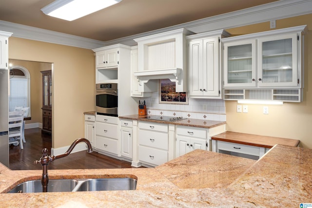 130 Eagle Pointe Way, Pell City, AL 35128 - kitchen featuring a sink, oven, ornamental molding, stovetop, and dark wood finished floors