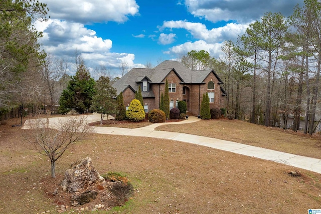 130 Eagle Pointe Way, Pell City, AL 35128 - view of front of property featuring brick siding, a front lawn, and roof with shingles