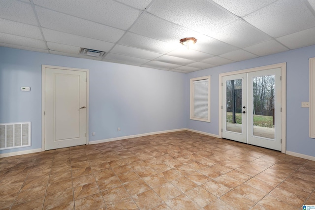 130 Eagle Pointe Way, Pell City, AL 35128 - empty room featuring a paneled ceiling, french doors, and baseboards