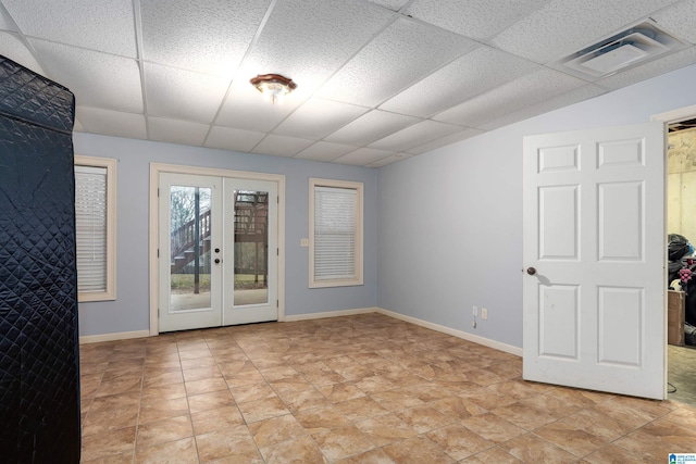 130 Eagle Pointe Way, Pell City, AL 35128 - empty room featuring a paneled ceiling, french doors, and baseboards