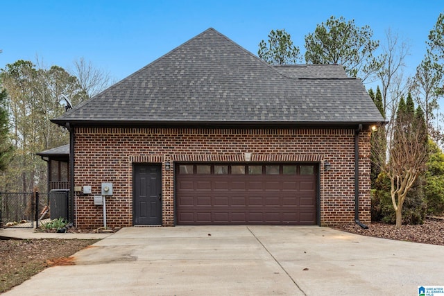 130 Eagle Pointe Way, Pell City, AL 35128 - view of home's exterior featuring a shingled roof, brick siding, driveway, and an attached garage