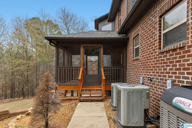 130 Eagle Pointe Way, Pell City, AL 35128 - doorway to property featuring central AC, brick siding, and a shingled roof