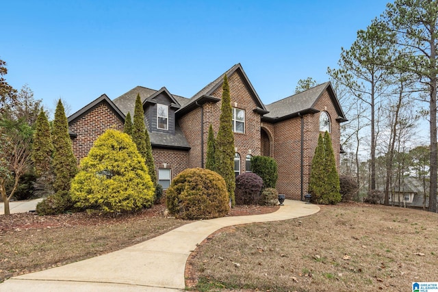 130 Eagle Pointe Way, Pell City, AL 35128 - view of front facade with brick siding, a shingled roof, and a front lawn