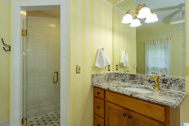 307 N Lake Rd, Hoover, AL 35242 - bathroom with a shower stall, vanity, and a chandelier