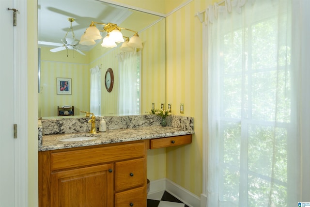 307 N Lake Rd, Hoover, AL 35242 - bathroom featuring vanity, ceiling fan, wallpapered walls, and baseboards