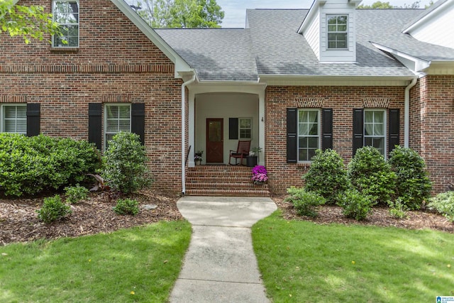 307 N Lake Rd, Hoover, AL 35242 - entrance to property featuring roof with shingles, brick siding, and a lawn