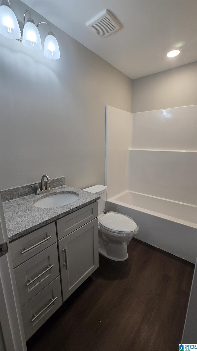 1077 Grande View Pass, Alabaster, AL 35114 - bathroom with wood finished floors, toilet, vanity, and shower / bathtub combination