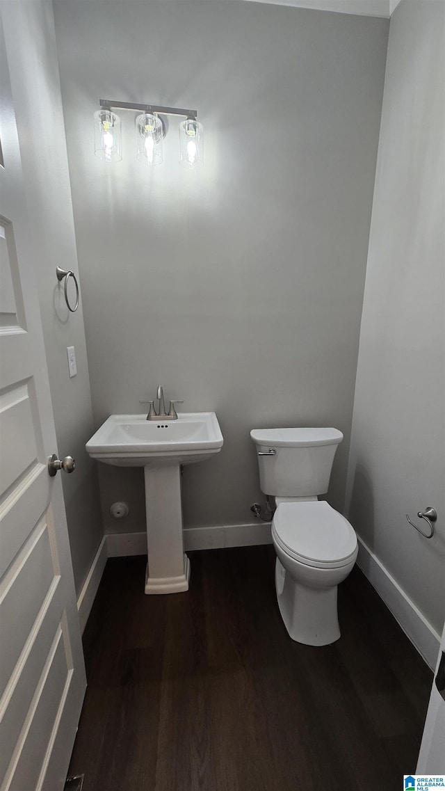 1077 Grande View Pass, Alabaster, AL 35114 - half bathroom featuring toilet, wood finished floors, and baseboards