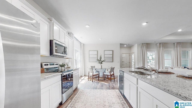 645 Fish Camp Rd, Chelsea, AL 35043 - kitchen featuring appliances with stainless steel finishes, a sink, plenty of natural light, white cabinetry, and recessed lighting