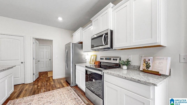 645 Fish Camp Rd, Chelsea, AL 35043 - kitchen featuring stainless steel appliances, dark wood-type flooring, white cabinetry, light stone countertops, and recessed lighting