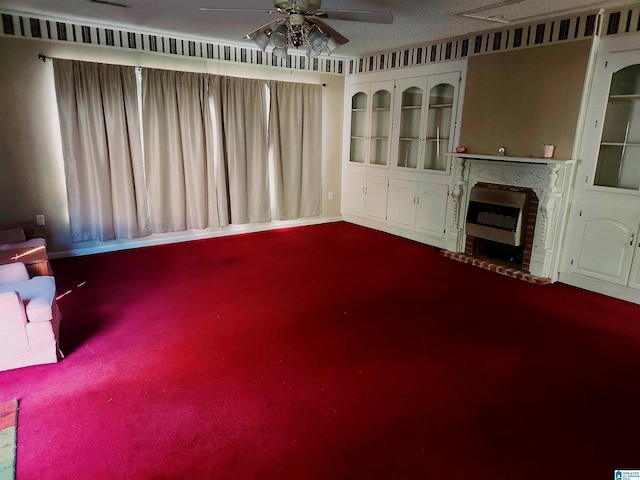 5810 Stemley Bridge Rd, Talladega, AL 35160 - unfurnished living room featuring dark colored carpet, a ceiling fan, and a fireplace